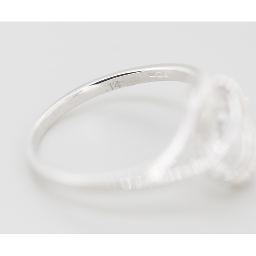 314 - Unusual Form Diamond Set Swirl Motif Ring Mounted in 9 Carat White Gold Ring Size O