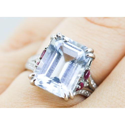 336 - Finely Detailed Emerald Cut Aquamarine Set Ring with Diamond Inset to Shoulders and Further Ruby Ins... 