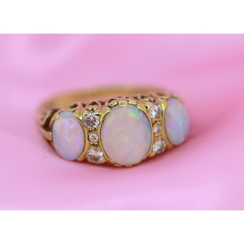 63 - Bezel Set Opal Three Stone Ring with Further Diamond Six Stone Inset Mounted in 18 Carat Yellow Gold... 
