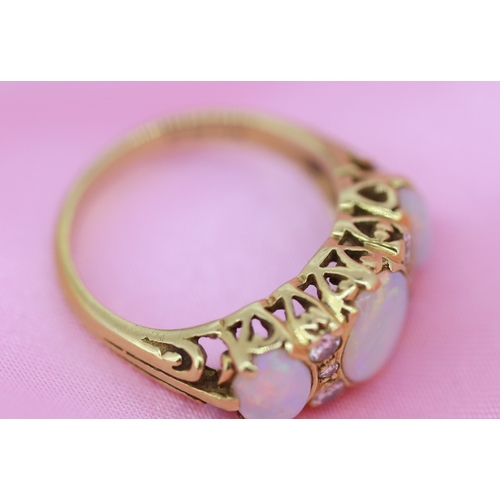 63 - Bezel Set Opal Three Stone Ring with Further Diamond Six Stone Inset Mounted in 18 Carat Yellow Gold... 