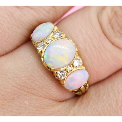 63 - Bezel Set Opal Three Stone Ring with Further Diamond Six Stone Inset Mounted in 18 Carat Yellow Gold... 