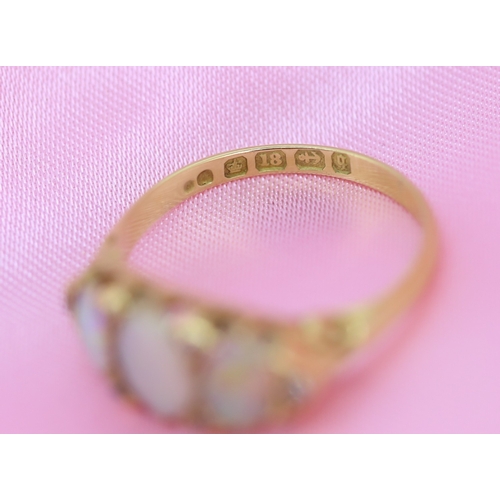 64 - Opal Three Stone Ring with Further Diamond Insets Mounted in 18 Carat Yellow Gold Ring Size O