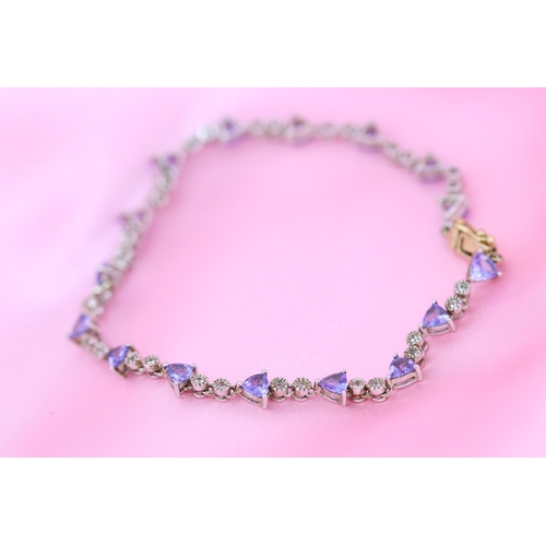 65 - Finely Detailed Triangle Cut Tanzanite and Diamond Set Ladies Bracelet Mounted in 14 Carat White and... 
