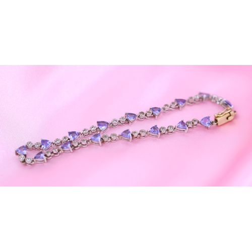 65 - Finely Detailed Triangle Cut Tanzanite and Diamond Set Ladies Bracelet Mounted in 14 Carat White and... 