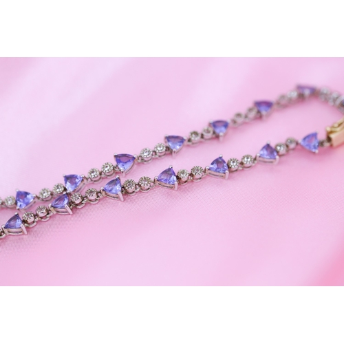 65 - Finely Detailed Triangle Cut Tanzanite and Diamond Set Ladies Bracelet Mounted in 14 Carat White and... 