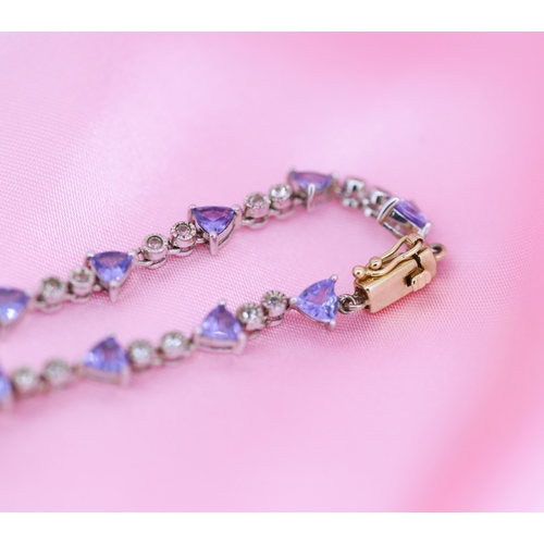 65 - Finely Detailed Triangle Cut Tanzanite and Diamond Set Ladies Bracelet Mounted in 14 Carat White and... 