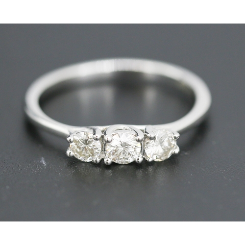69 - Diamond Three Stone Ring Mounted in 14 Carat White Gold Total Diamond Carat Weight Approximately .75... 