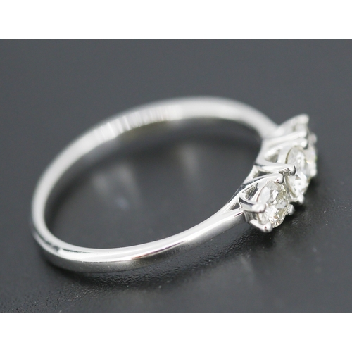 69 - Diamond Three Stone Ring Mounted in 14 Carat White Gold Total Diamond Carat Weight Approximately .75... 