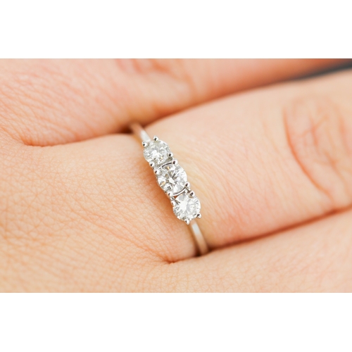 69 - Diamond Three Stone Ring Mounted in 14 Carat White Gold Total Diamond Carat Weight Approximately .75... 