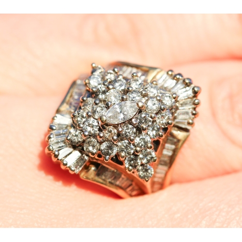 7 - Finely Detailed Marquise Cut Round Cut and Tapered Baguette Cut Diamond Set Cluster Ring Mounted in ... 