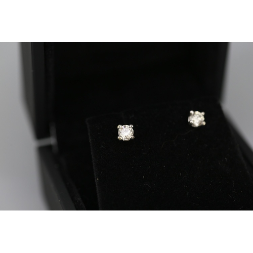 76 - Pair of Diamond Solitaire Earrings Mounted in 9 Carat White Gold Total Diamond Carat Weight Approxim... 