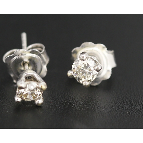 76 - Pair of Diamond Solitaire Earrings Mounted in 9 Carat White Gold Total Diamond Carat Weight Approxim... 