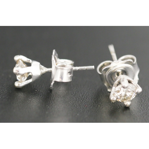 76 - Pair of Diamond Solitaire Earrings Mounted in 9 Carat White Gold Total Diamond Carat Weight Approxim... 