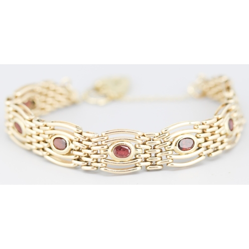 78 - Attractively Detailed Red Garnet Bezel Set Seven Stone Gate Link Bracelet Mounted in 9 Carat Yellow ... 