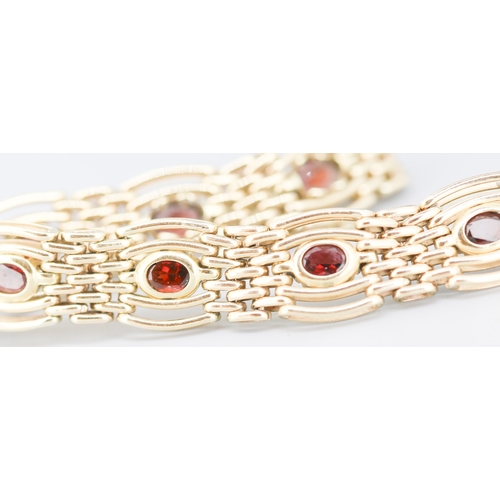 78 - Attractively Detailed Red Garnet Bezel Set Seven Stone Gate Link Bracelet Mounted in 9 Carat Yellow ... 