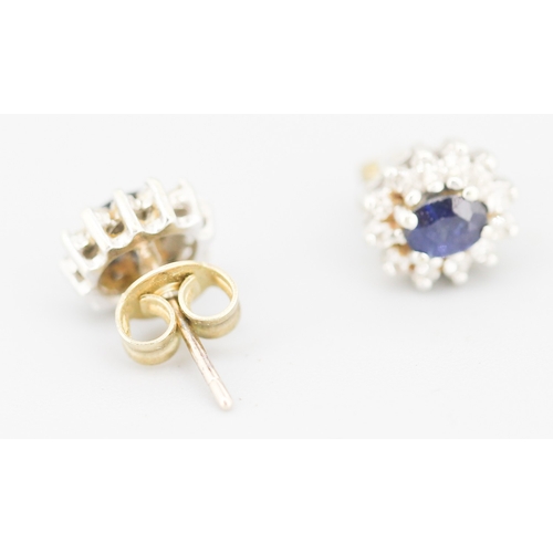 84 - Pair of Sapphire Set Earrings with Diamond Set Halo Mounted in 9 Carat Yellow Gold 8mm High
