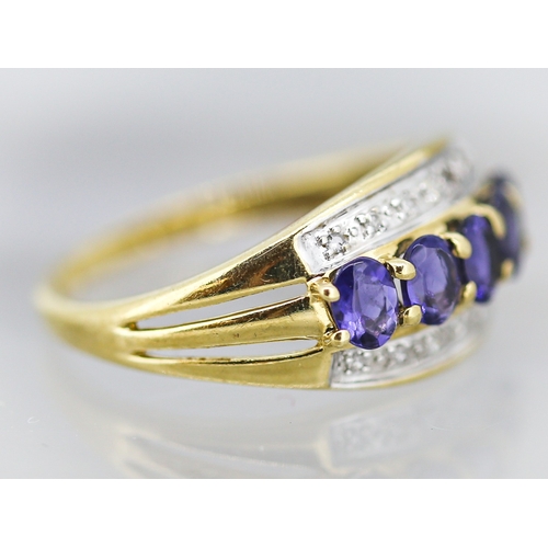 1 - Tanzanite Five Stone Set Ring with Further Diamond Inset to Sides Mounted in 9 Carat Yellow Gold Rin... 