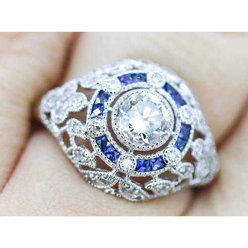 11 - Finely Detailed Diamond Centre Stone Ring with Sapphire and Diamond Set Cluster Surround Floral Moti... 