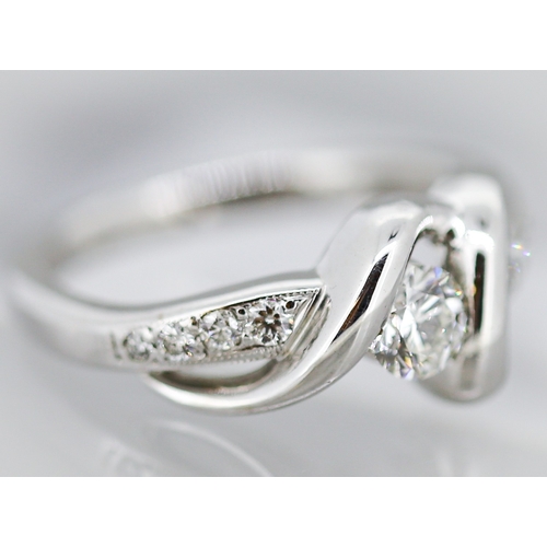13 - Diamond Centre Stone Ring Ribbon Form with Further Diamonds Set to Shoulders Mounted in 18 Carat Whi... 