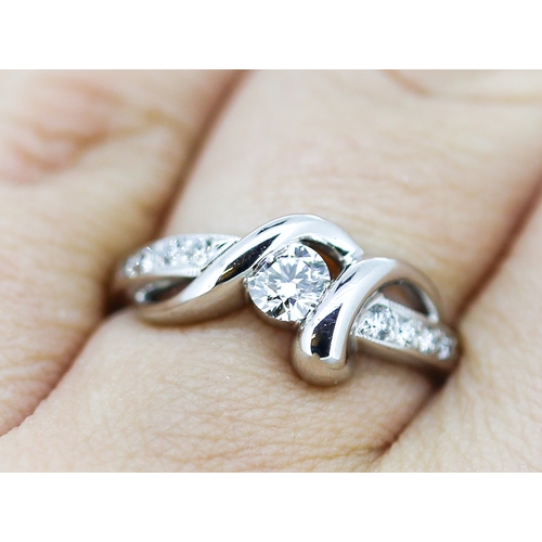 13 - Diamond Centre Stone Ring Ribbon Form with Further Diamonds Set to Shoulders Mounted in 18 Carat Whi... 