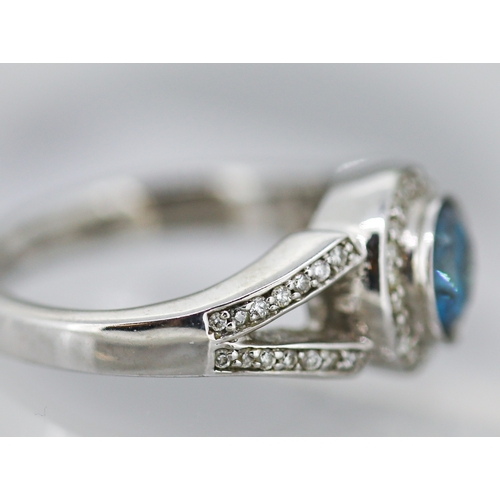 14 - Blue Diamond Solitaire with Diamond Halo Surround and Further Diamond Inset to Shoulders Mounted in ... 