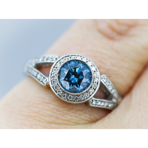 14 - Blue Diamond Solitaire with Diamond Halo Surround and Further Diamond Inset to Shoulders Mounted in ... 
