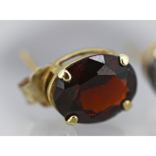 17 - Pair of Red Garnet Set Single Stone Earrings Mounted in 9 Carat Yellow Gold 1cm