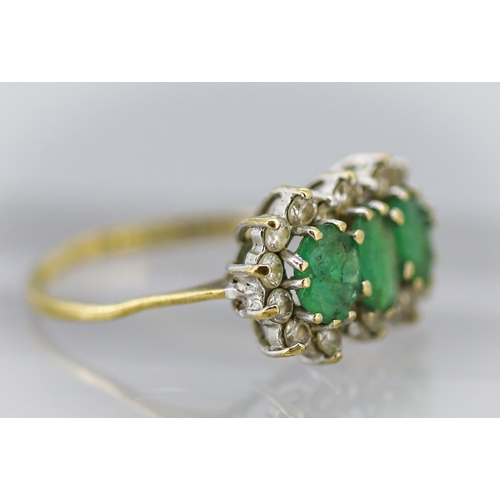 18 - Emerald Three Stone Ring with Gemset Cluster Surround Mounted in 9 Carat Yellow Gold Ring Size O