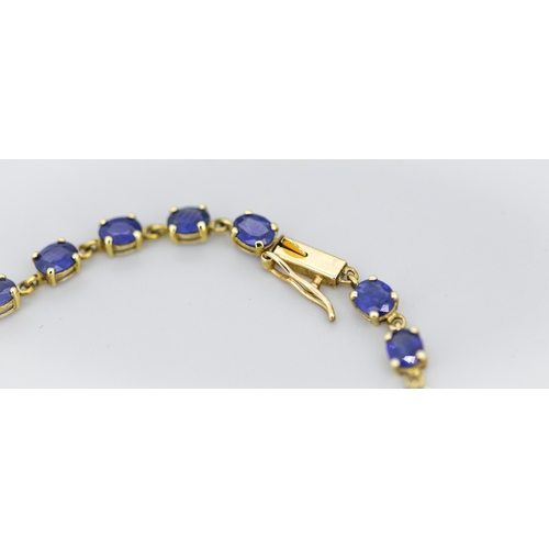 2 - Sapphire Twenty-Two Stone Set Tennis Bracelet Mounted in 9 Carat Yellow Gold 19cm Long