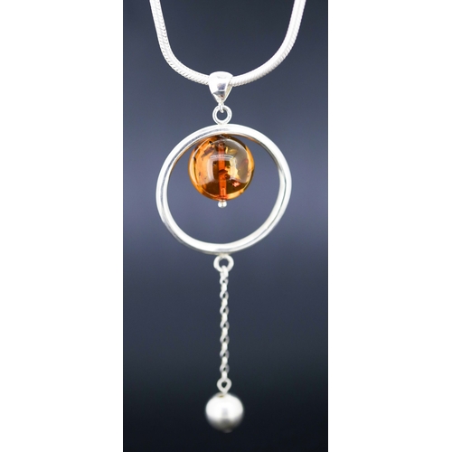 21 - Amber Set Globe Drop Pendant Mounted in Silver 5cm Diameter Set on Silver Chain 42cm Long