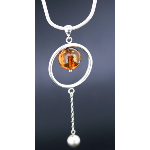 21 - Amber Set Globe Drop Pendant Mounted in Silver 5cm Diameter Set on Silver Chain 42cm Long