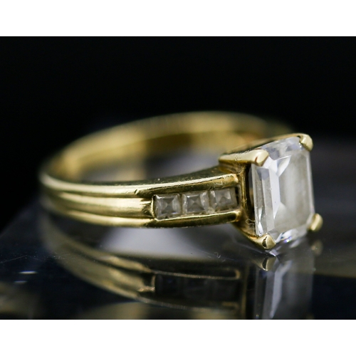 30 - Emerald Cut Cubic Zirconia Set Ring with Further Gemstone Set to Shoulders Mounted in 9 Carat Yellow... 