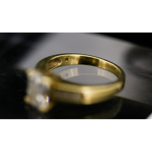 30 - Emerald Cut Cubic Zirconia Set Ring with Further Gemstone Set to Shoulders Mounted in 9 Carat Yellow... 