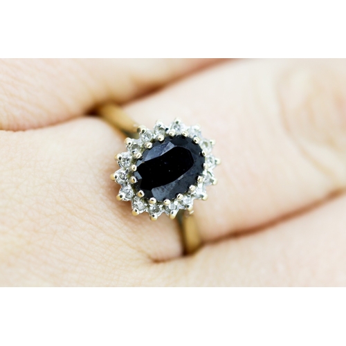 32 - Sapphire Set Ring with Diamond Set Halo Surround Mounted in 9 Carat Yellow Gold Ring Size O and a Ha... 
