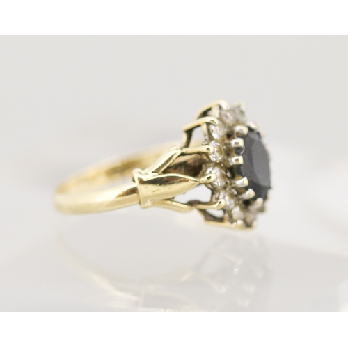 49 - Sapphire Set Ring with Cubic Zirconia Set Halo Surround Mounted in 9 Carat Yellow Gold Ring Size N a... 