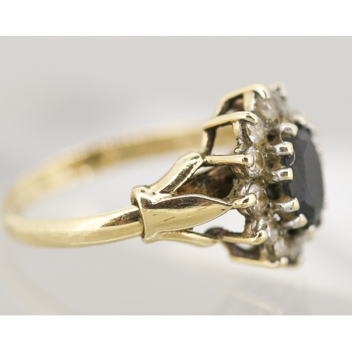 49 - Sapphire Set Ring with Cubic Zirconia Set Halo Surround Mounted in 9 Carat Yellow Gold Ring Size N a... 
