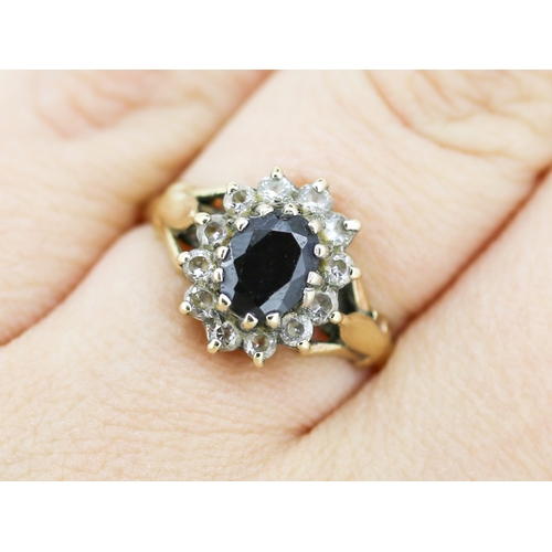 49 - Sapphire Set Ring with Cubic Zirconia Set Halo Surround Mounted in 9 Carat Yellow Gold Ring Size N a... 