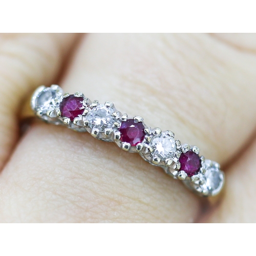 5 - Ruby and Cubic Zirconia Set Seven Stone Set Ring Mounted in 9 Carat Yellow Gold Ring Size Q