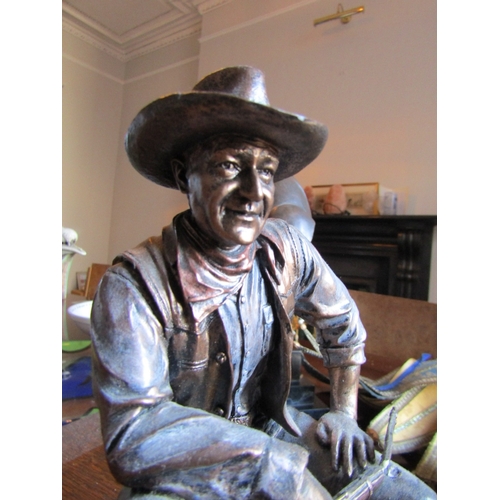 13 - Bronzed Figure John Wayne Seated with Rifle and Stetson Attractively Modelled Approximately 9 Inches... 