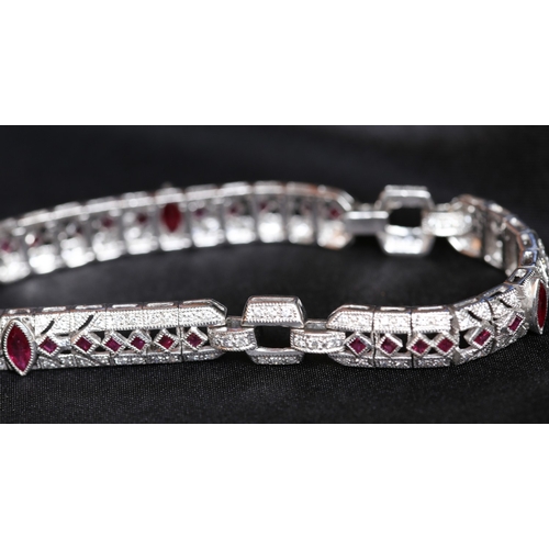 12 - Finely Detailed Marquise and Round Cut Ruby and Diamond Cluster Set Bracelet Mounted in 18 Carat Whi... 