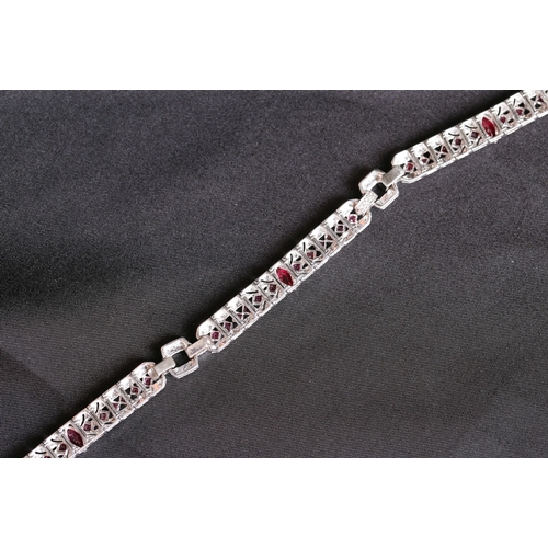 12 - Finely Detailed Marquise and Round Cut Ruby and Diamond Cluster Set Bracelet Mounted in 18 Carat Whi... 