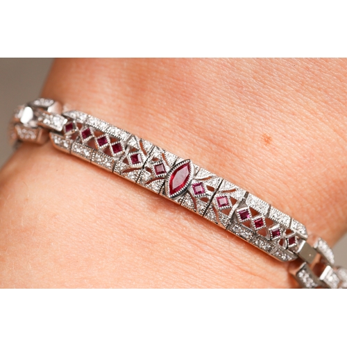 12 - Finely Detailed Marquise and Round Cut Ruby and Diamond Cluster Set Bracelet Mounted in 18 Carat Whi... 