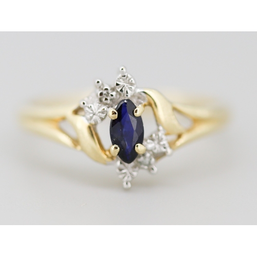 16 - Attractively Detailed Marquise Cut Sapphire Set Ring with Diamond Inset Mounted in 10 Carat Yellow G... 
