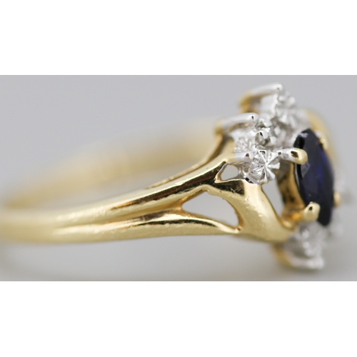 16 - Attractively Detailed Marquise Cut Sapphire Set Ring with Diamond Inset Mounted in 10 Carat Yellow G... 