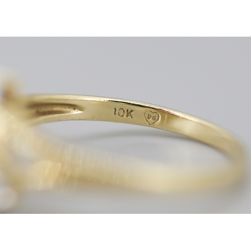 16 - Attractively Detailed Marquise Cut Sapphire Set Ring with Diamond Inset Mounted in 10 Carat Yellow G... 