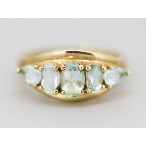 18 - Oval and Pear Cut Aquamarine Set Five Stone Ring Mounted in 9 Carat Yellow Gold Ring Size K and a Ha... 