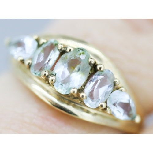 18 - Oval and Pear Cut Aquamarine Set Five Stone Ring Mounted in 9 Carat Yellow Gold Ring Size K and a Ha... 