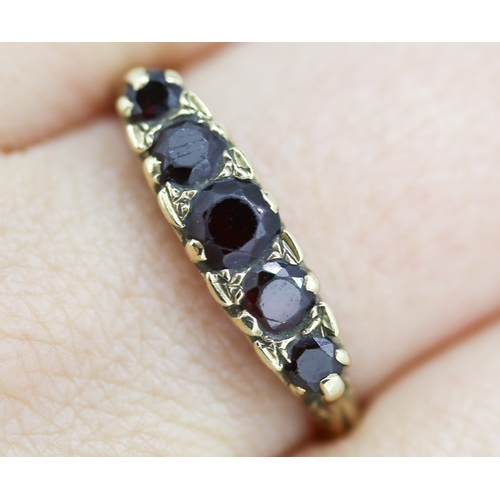 51 - Red Garnet Five Stone Graduated Form Ring Mounted in 9 Carat Yellow Gold Ring Size U and a Half