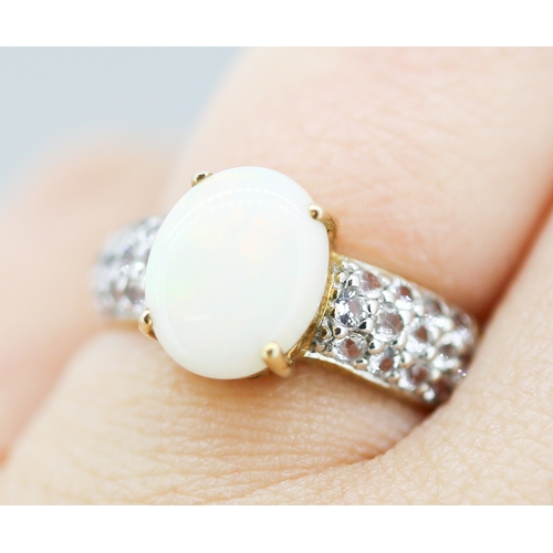 52 - Opal Set Ring with Gemstone Cluster Set Shoulders Mounted in 9 Carat Yellow Gold Ring Size N