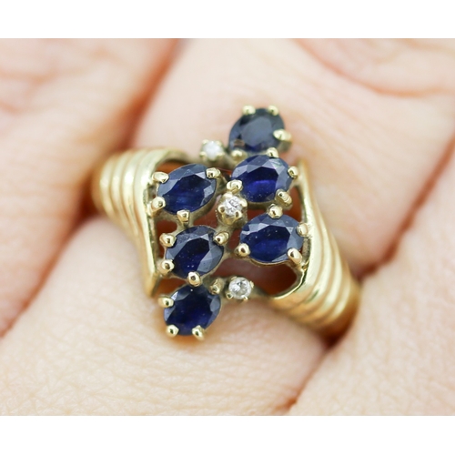 53 - Attractively Detailed Sapphire Six Stone Set Ring with Further Diamonds Insets Mounted in 9 Carat Ye... 